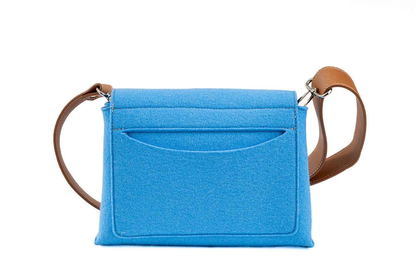 JOY Light Blue Crossbody Bag: Small, ergonomic, and stylish with three pockets (2 external, 1 internal) for organizing essentials. Features an adjustable vegan leather strap, flap closure with magnetic buttons, and a Lefrac logo pendant. Handmade in Italy, includes a dust bag.