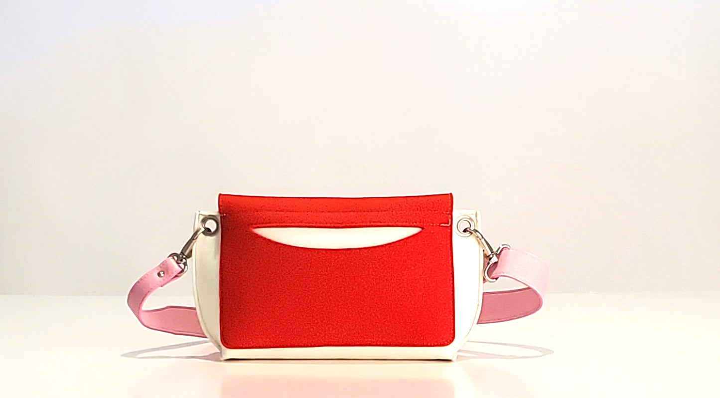 GREGOR Red Beltbag: Compact yet spacious, made from 3mm merino wool felt with vegan leather. Features two external pockets for large phones, a small internal pocket, and a secure flap with magnetic buttons. Adjustable strap for versatile wear. Handmade in Italy. Includes dust bag. - Lefrac