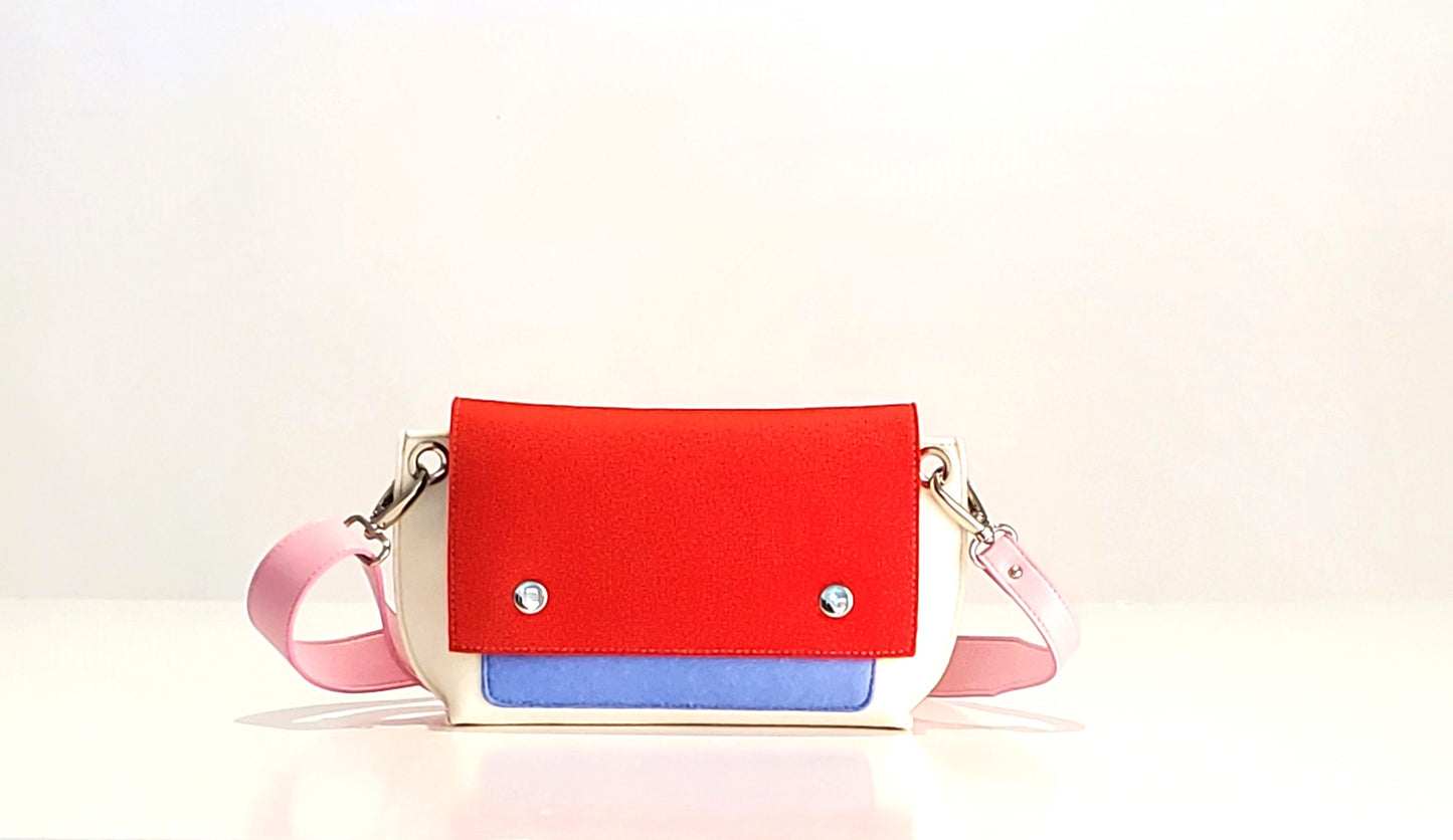 GREGOR Red Beltbag: Compact yet spacious, made from 3mm merino wool felt with vegan leather. Features two external pockets for large phones, a small internal pocket, and a secure flap with magnetic buttons. Adjustable strap for versatile wear. Handmade in Italy. Includes dust bag. - Lefrac