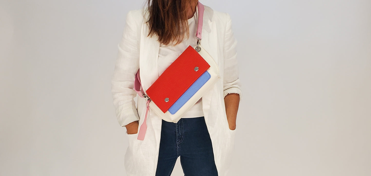 GREGOR Red Beltbag: Compact yet spacious, made from 3mm merino wool felt with vegan leather. Features two external pockets for large phones, a small internal pocket, and a secure flap with magnetic buttons. Adjustable strap for versatile wear. Handmade in Italy. Includes dust bag. - Lefrac
