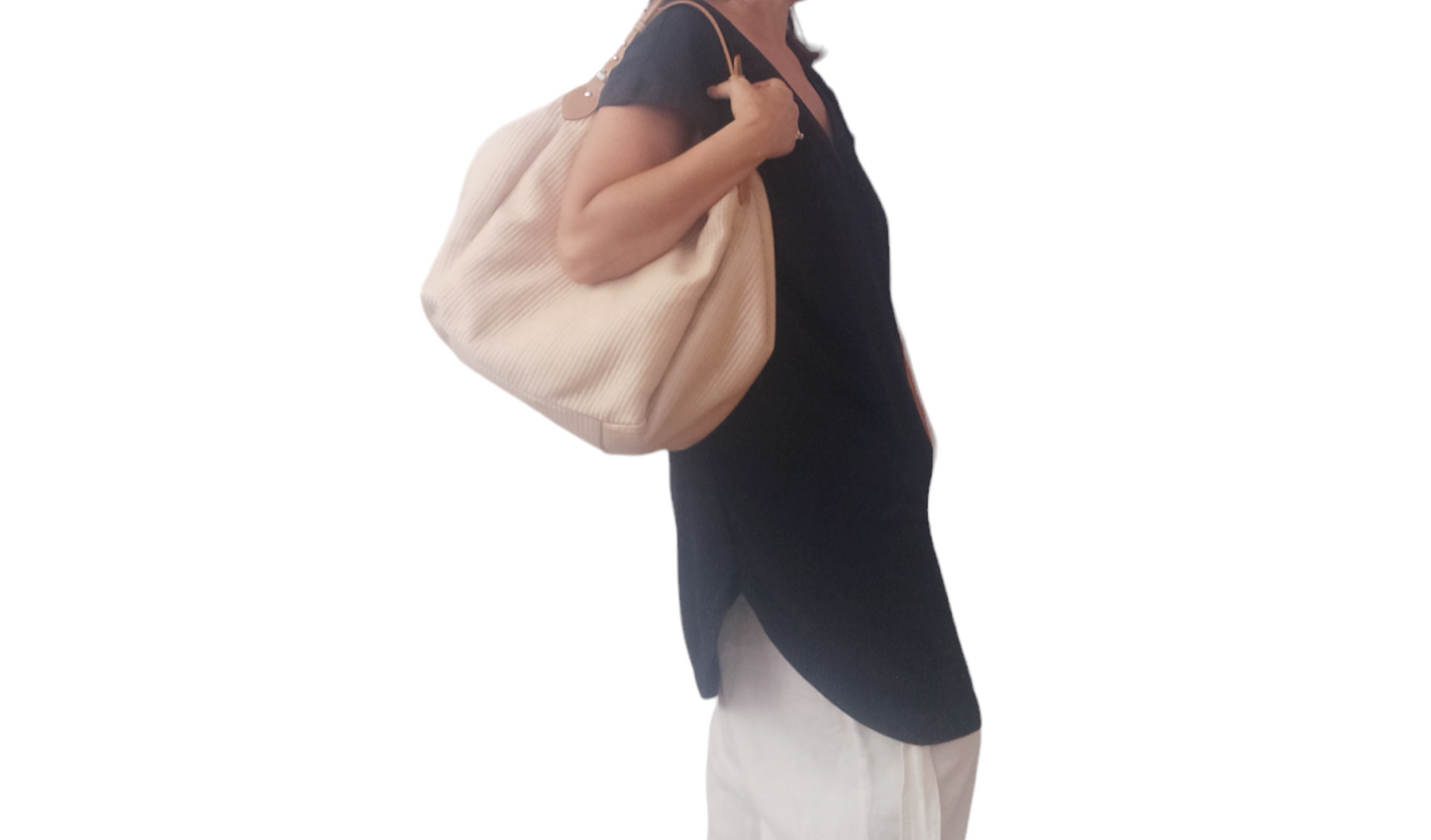 Beige Margot bag: large, soft, and lightweight, crafted from cotton with a raffia-like texture. Features vintage-style vegan leather handles, 3 large pockets (one zippered), internal magnetic button, and a leather lace with carabiner for adjustable shape. Measures 36cm H x 36-56cm W x 25cm D. Comes with a dust bag and tracking. Vegan leather is 69% organic materials.- Lefrac
