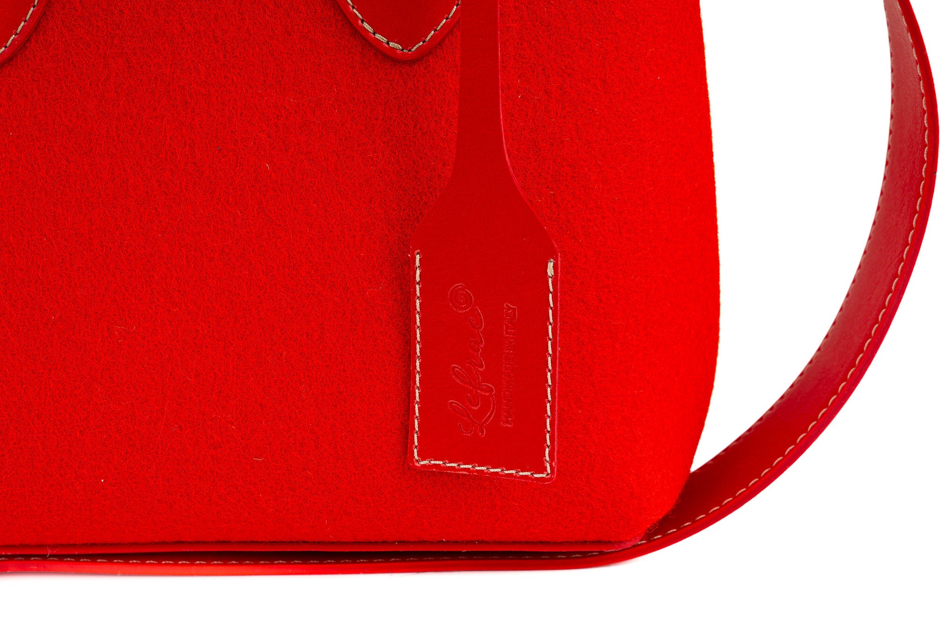 EMMA RED MINI bag, date night size, made of durable 3mm Merino wool felt with vegan leather handles, detachable strap, and 2 roomy pockets. Features a magnetic button closure and vintage style. Handmade in Italy. Sustainable, biodegradable, and eco-friendly materials. Ideal for carrying essentials securely. - Lefrac