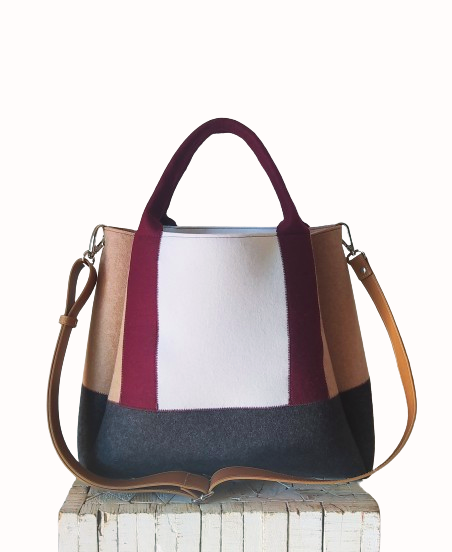 Diane Bag,in color blocks, is a large bag with a particular cloud shape which gives it a wide internal space and an attractive design. Equipped with two large pockets and can be carried by hand, over the shoulder and across the body, 3mm Merino Wool Felt.  Detachable Vegan leather strap made from organic materials, 2 inside pockets. Two internal magnetic buttons allow you to keep your essentials safe. -Lefrac