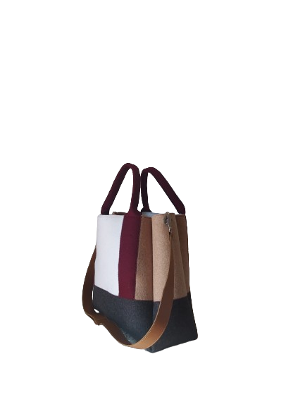 Diane Bag,in color blocks, is a large bag with a particular cloud shape which gives it a wide internal space and an attractive design. Equipped with two large pockets and can be carried by hand, over the shoulder and across the body, 3mm Merino Wool Felt.  Detachable Vegan leather strap made from organic materials, 2 inside pockets. Two internal magnetic buttons allow you to keep your essentials safe. -Lefrac