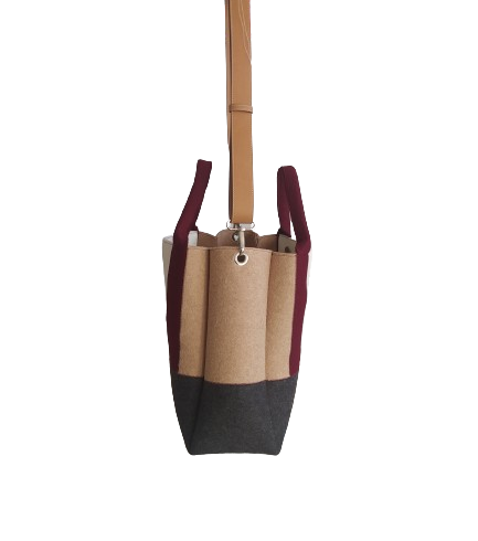 Diane Bag,in color blocks, is a large bag with a particular cloud shape which gives it a wide internal space and an attractive design. Equipped with two large pockets and can be carried by hand, over the shoulder and across the body, 3mm Merino Wool Felt.  Detachable Vegan leather strap made from organic materials, 2 inside pockets. Two internal magnetic buttons allow you to keep your essentials safe. -Lefrac