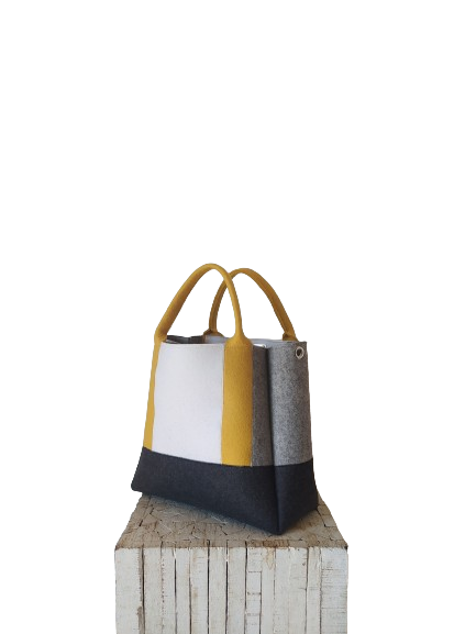 Diane Bag,in color blocks, is a large bag with a particular cloud shape which gives it a wide internal space and an attractive design. Equipped with two large pockets and can be carried by hand, over the shoulder and across the body, 3mm Merino Wool Felt.  Detachable Vegan leather strap made from organic materials, 2 inside pockets. Two internal magnetic buttons allow you to keep your essentials safe. -Lefrac