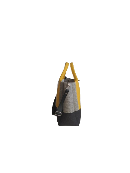 Diane Bag,in color blocks, is a large bag with a particular cloud shape which gives it a wide internal space and an attractive design. Equipped with two large pockets and can be carried by hand, over the shoulder and across the body, 3mm Merino Wool Felt.  Detachable Vegan leather strap made from organic materials, 2 inside pockets. Two internal magnetic buttons allow you to keep your essentials safe. -Lefrac