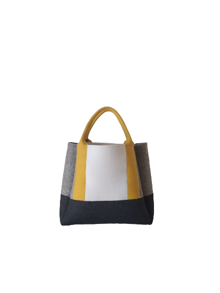 Diane Bag,in color blocks, is a large bag with a particular cloud shape which gives it a wide internal space and an attractive design. Equipped with two large pockets and can be carried by hand, over the shoulder and across the body, 3mm Merino Wool Felt.  Detachable Vegan leather strap made from organic materials, 2 inside pockets. Two internal magnetic buttons allow you to keep your essentials safe. -Lefrac