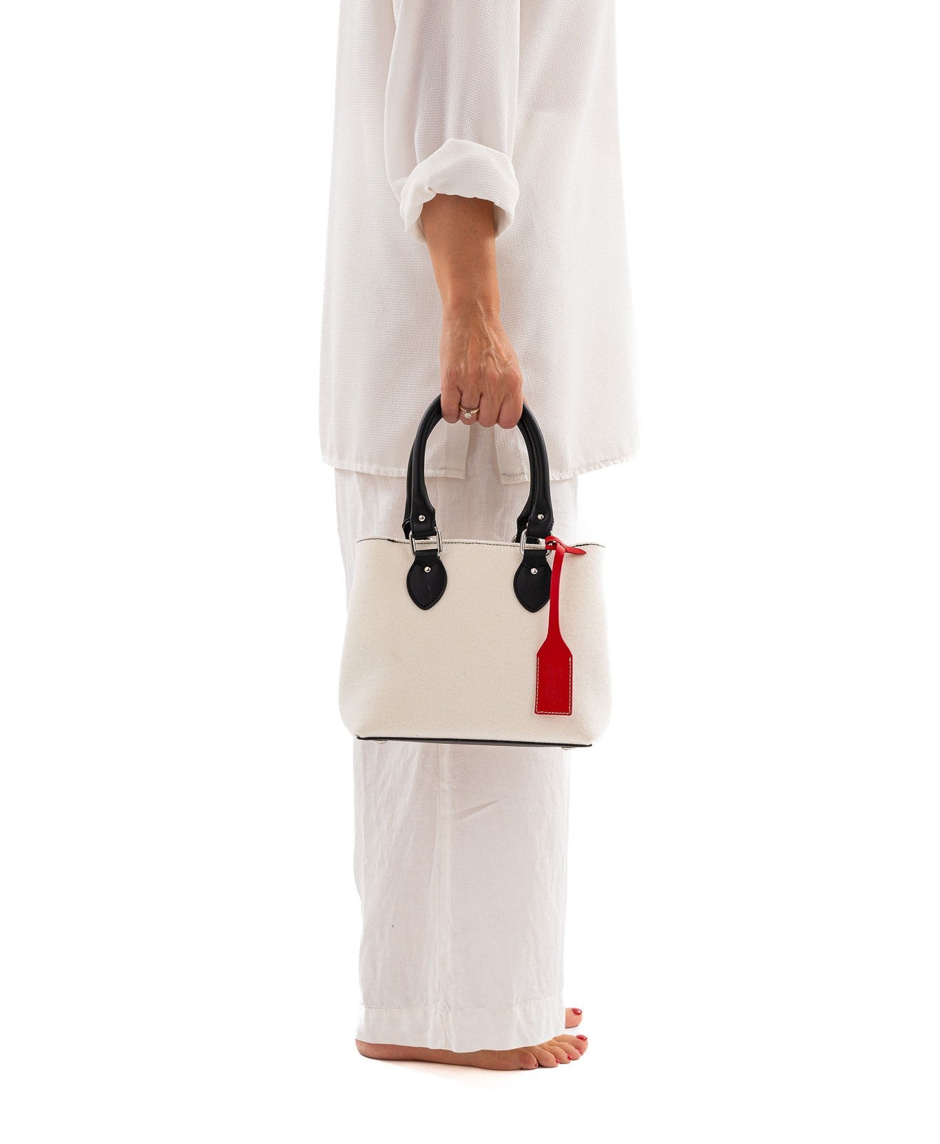 EMMA Red Multi-Color Mini Handbag made from sustainable merino wool felt and eco-friendly vegan leather. Features a vintage-inspired design with a unique worn look, showcasing durability, water resistance, and a blend of vibrant colors. Ideal for a stylish and eco-conscious accessory. - Lefrac