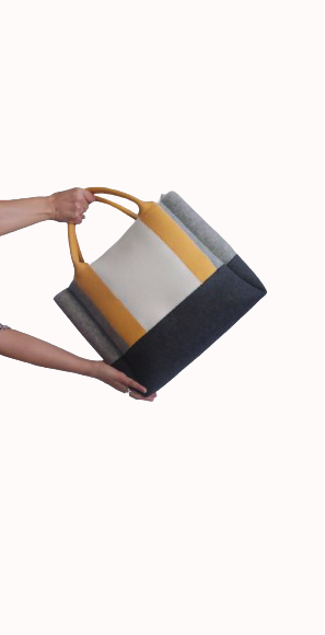 Diane Bag,in color blocks, is a large bag with a particular cloud shape which gives it a wide internal space and an attractive design. Equipped with two large pockets and can be carried by hand, over the shoulder and across the body, 3mm Merino Wool Felt.  Detachable Vegan leather strap made from organic materials, 2 inside pockets. Two internal magnetic buttons allow you to keep your essentials safe. -Lefrac