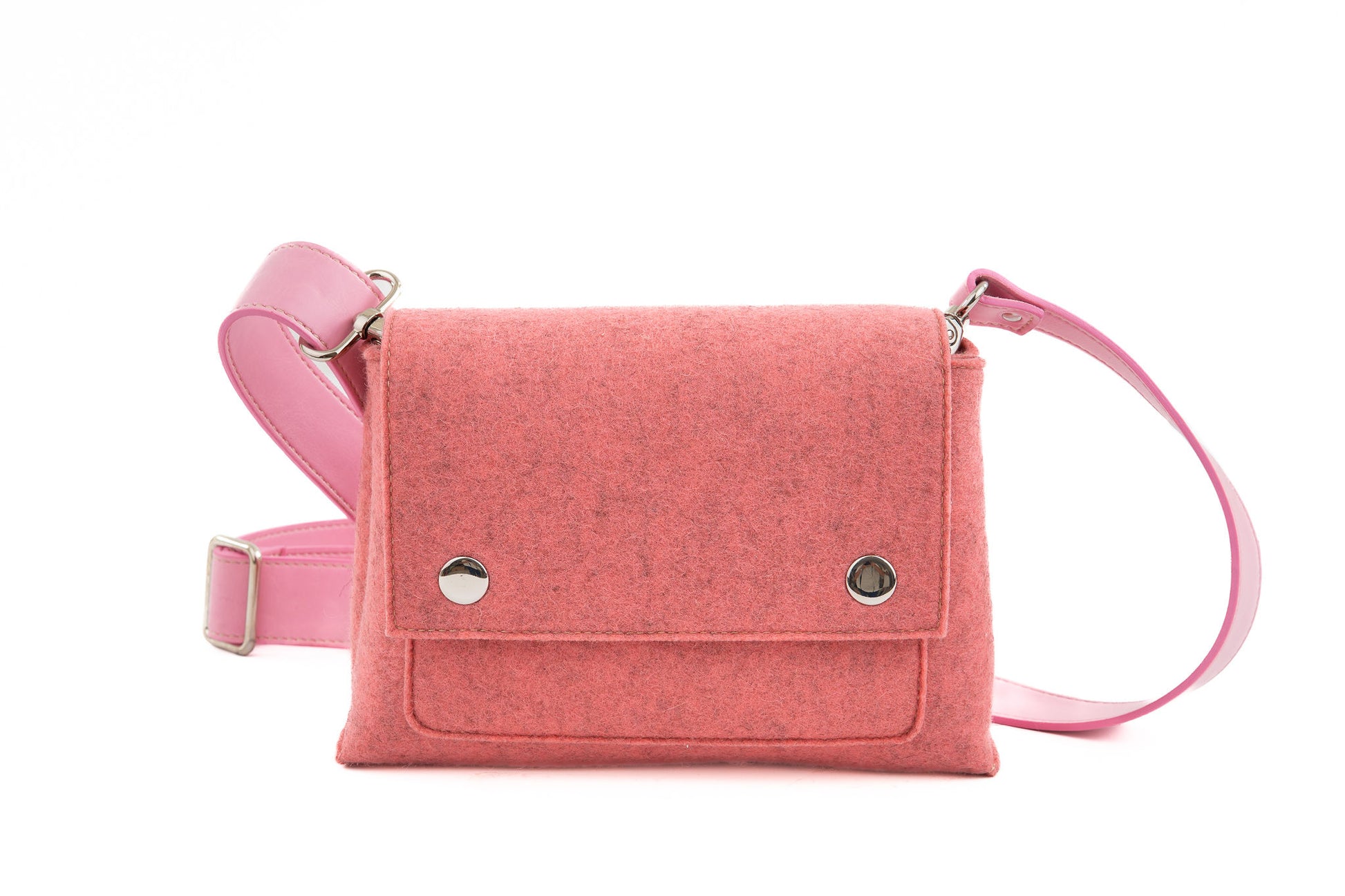 JOY Pink Crossbody Bag: Small, ergonomic, and versatile with three pockets (2 external, 1 internal) for essentials. Features an adjustable vegan leather strap, flap closure with magnetic buttons, and a Lefrac logo pendant. Handmade in Italy and includes a dust bag.