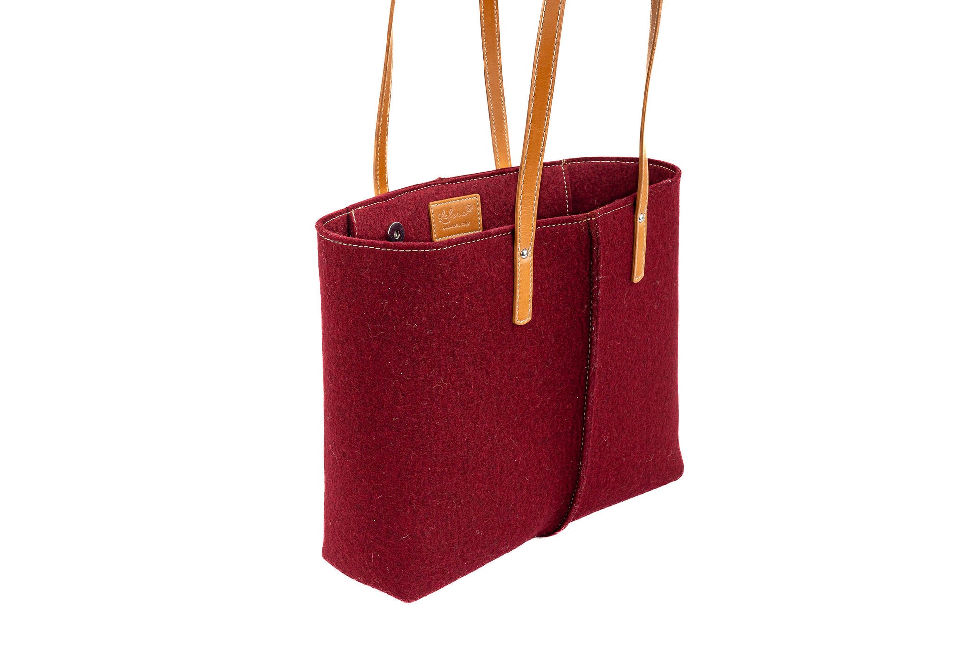 Tote Bag Medium Bordeaux in Merino wool felt with vegan leather. Features 2 internal pockets, magnetic buttons, and a 27 cm handle drop. Handmade in Italy.-Lefrac