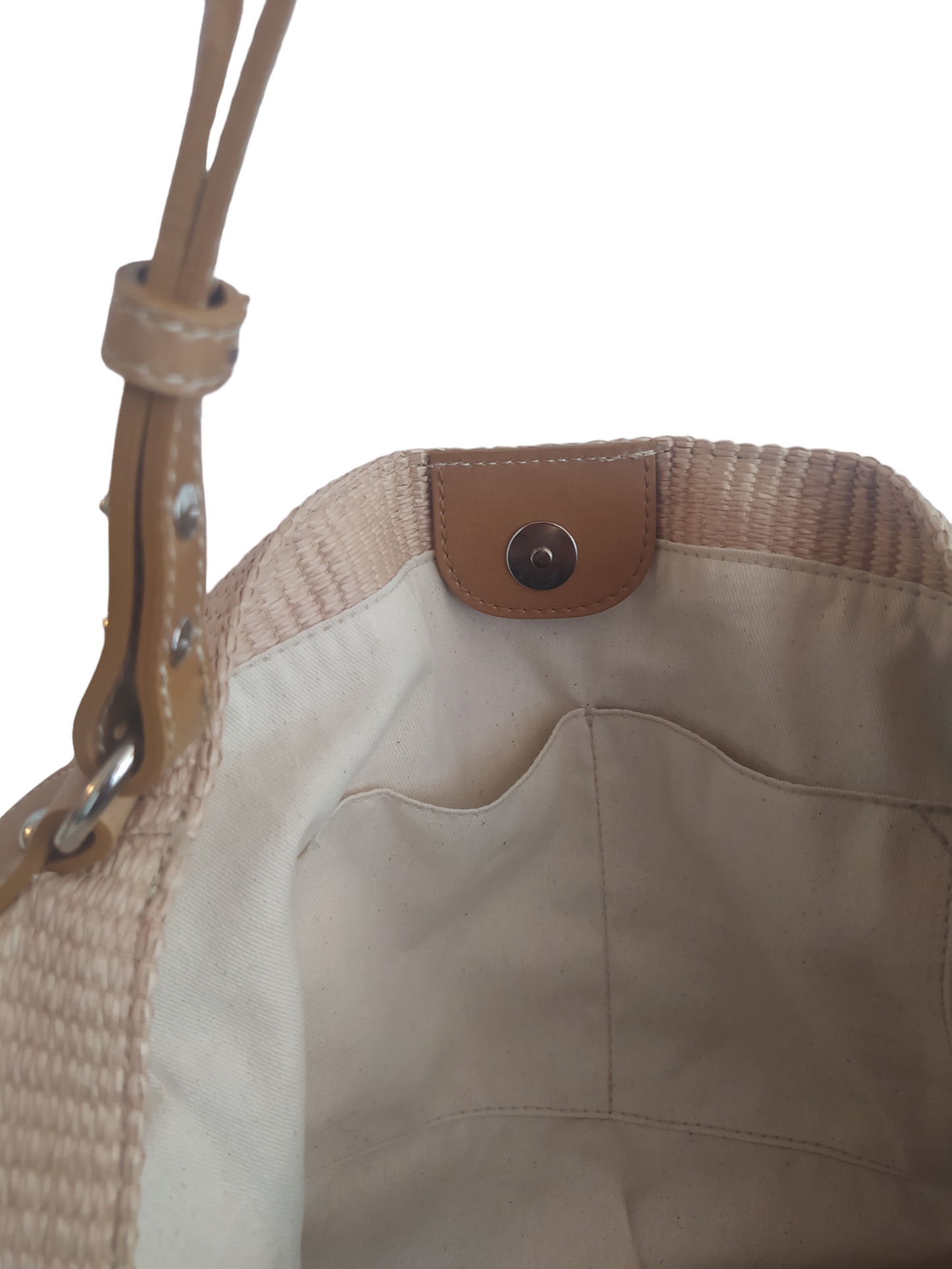 Beige Margot bag: large, soft, and lightweight, crafted from cotton with a raffia-like texture. Features vintage-style vegan leather handles, 3 large pockets (one zippered), internal magnetic button, and a leather lace with carabiner for adjustable shape. Measures 36cm H x 36-56cm W x 25cm D. Comes with a dust bag and tracking. Vegan leather is 69% organic materials.- Lefrac